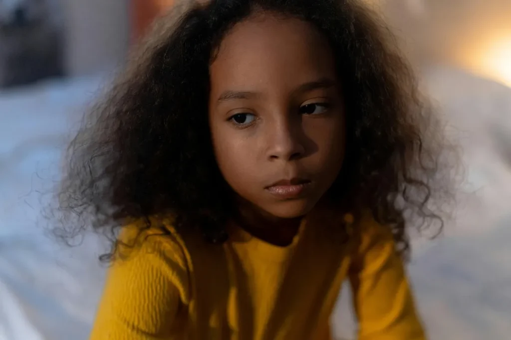 Young child sitting quietly during a reflective moment