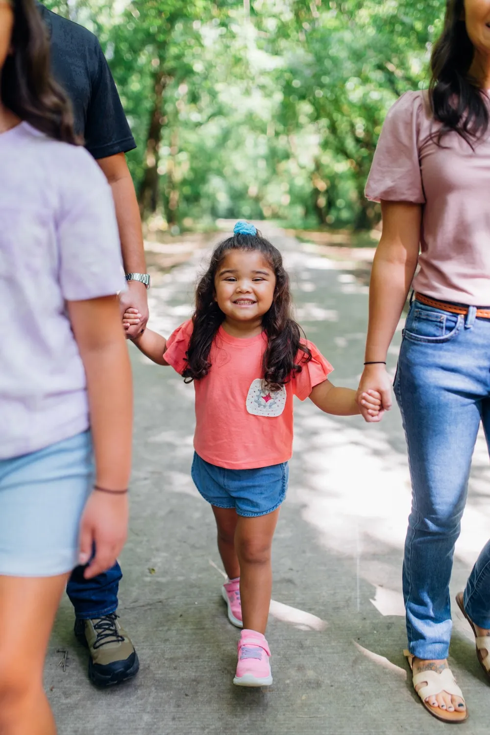 Family walking together along outdoor path